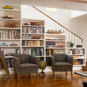 https://cdn.homedit.com/wp-content/uploads/2012/05/storage-ideas-under-stairs-in-livingroom.jpg